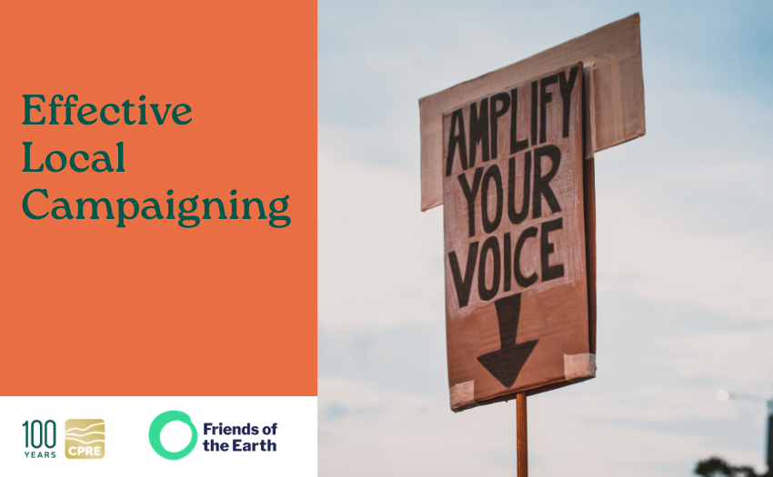 A placard showing the words 'Amplify your voice'